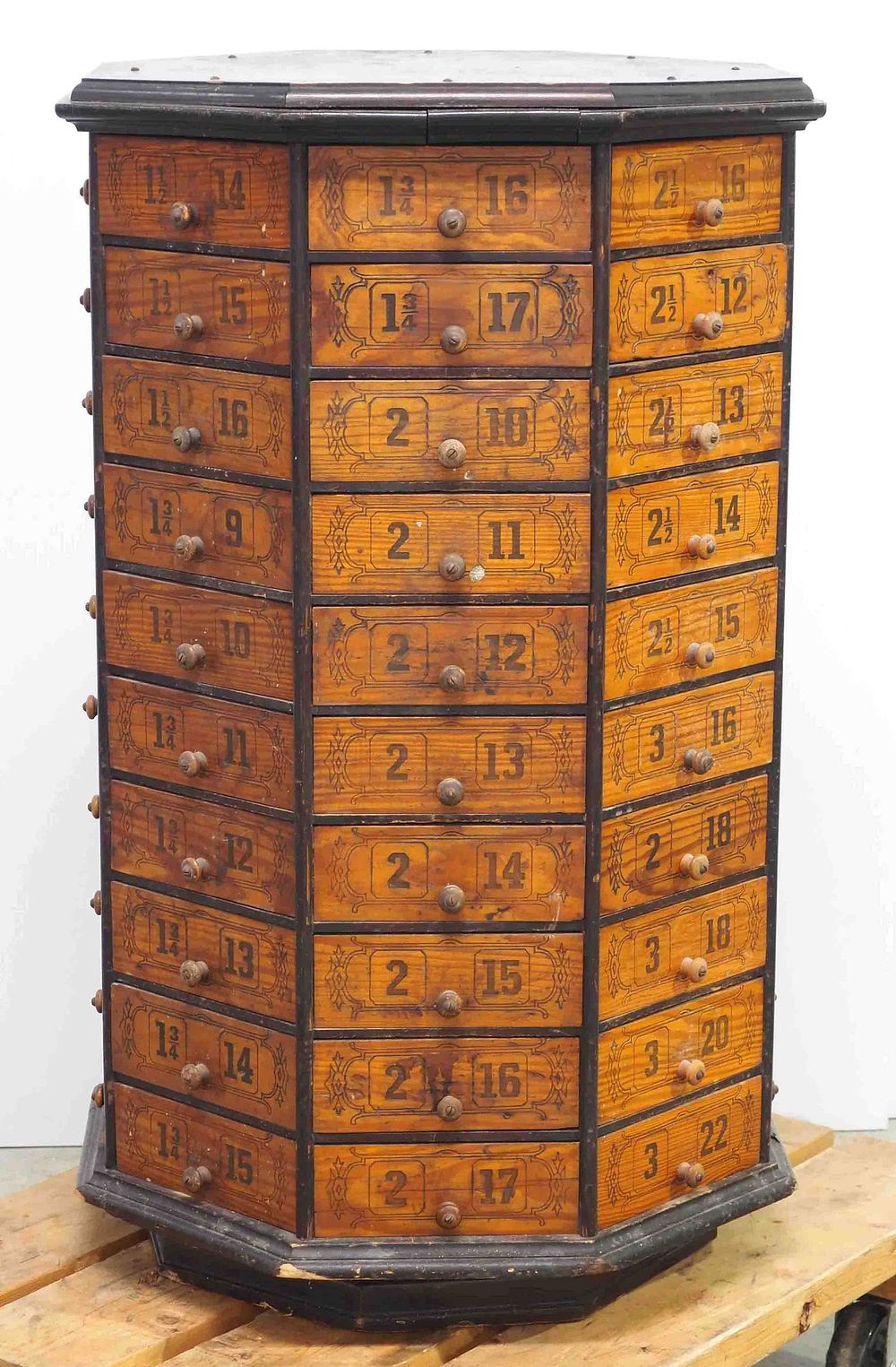 Lot 1334: Wooden, rotating, octagon 80-drawer bolt bin