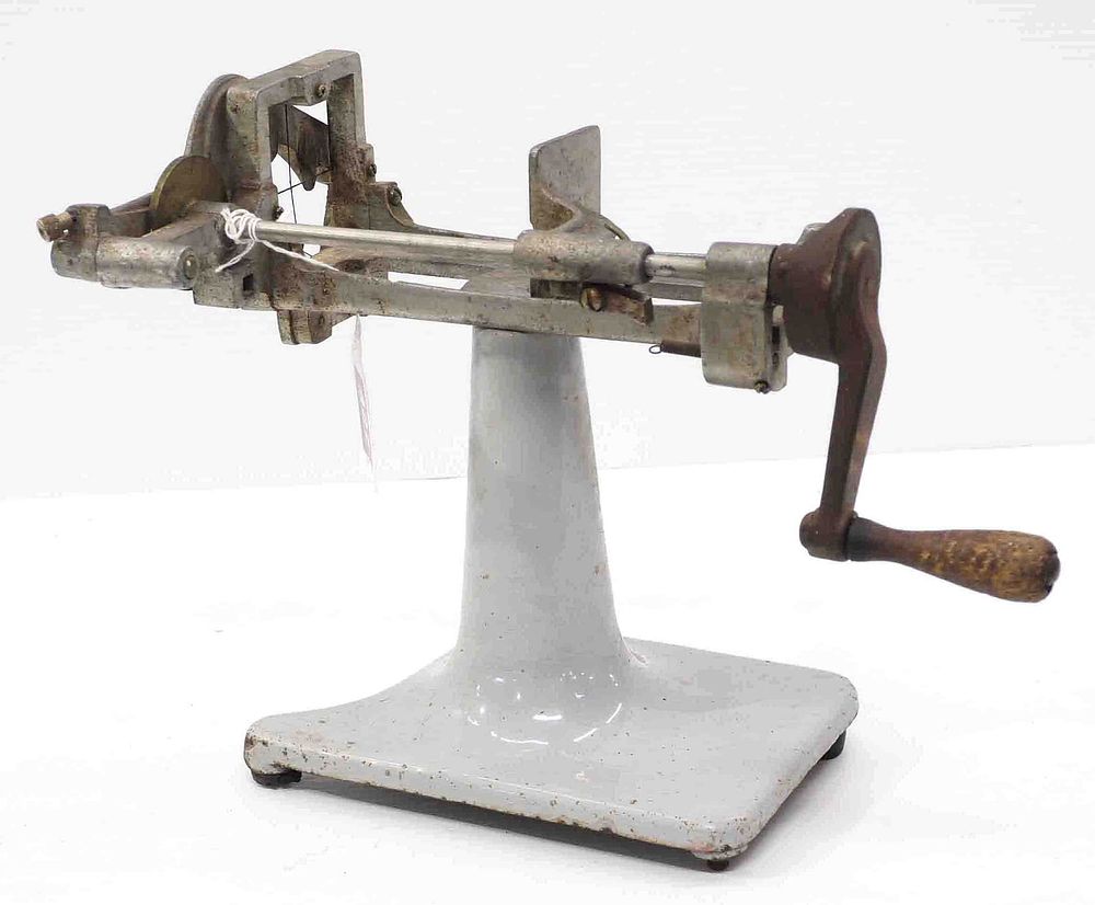 Lot 427: Tabletop hand-crank cutter with porcelain base