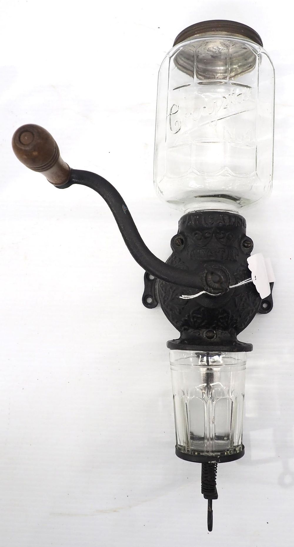 Lot 1244: Arcade Crystal cast iron wall-mount coffee grinder