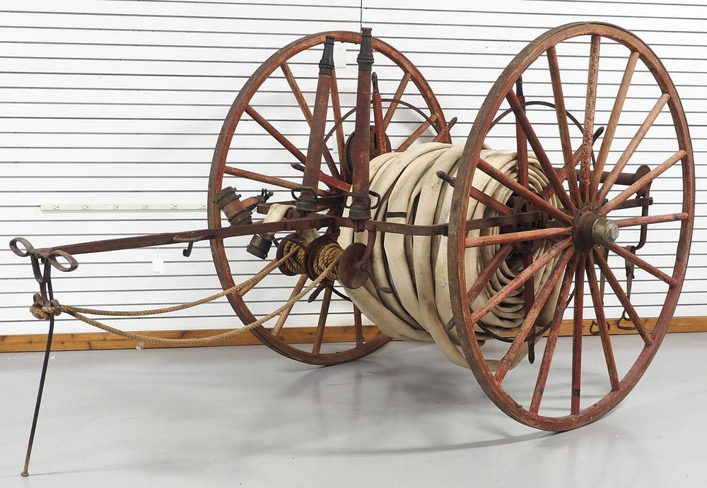 Lot 359: WOW! Early horse-drawn fire hose cart