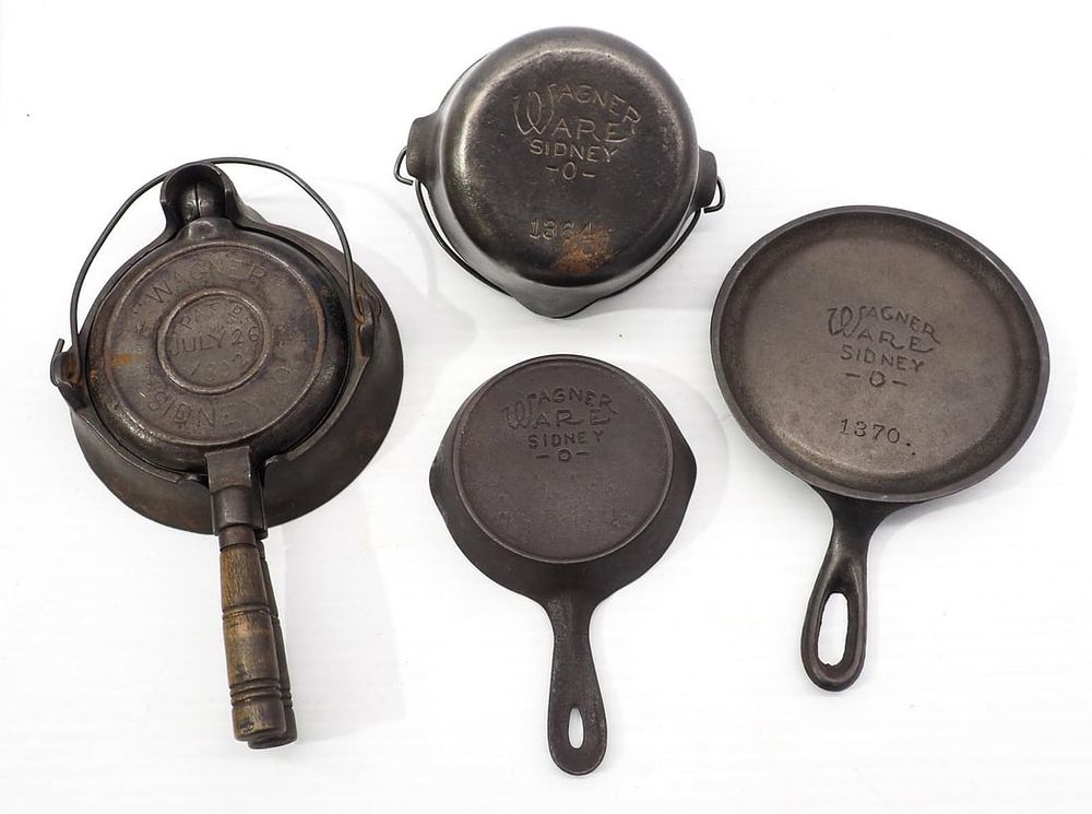 Lot 389: 4-pc child's cast iron Wagner set