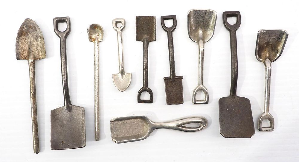 Lot 394: (10) Miniature cast iron shovels