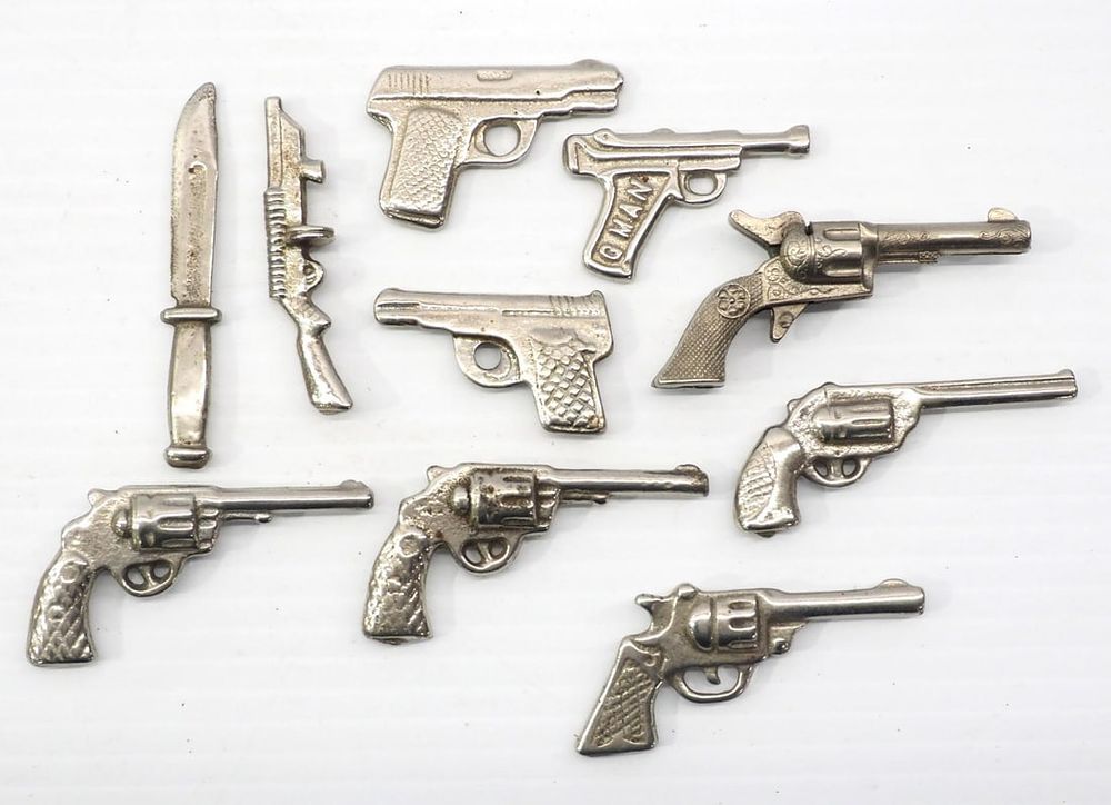 Lot 402: (10) Miniature cast iron guns
