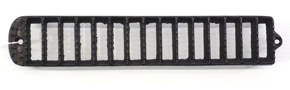 Lot 680: Cast iron corn scrubber