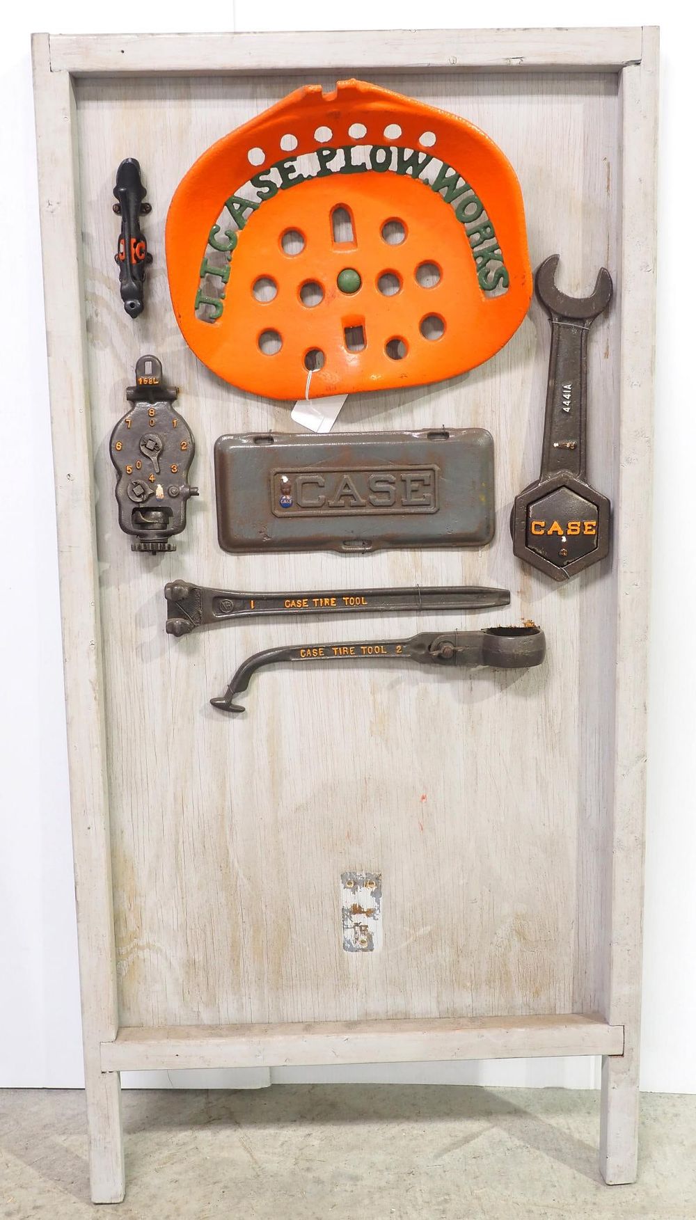 Lot 738: Board with JI Case seat, Case car tools & more