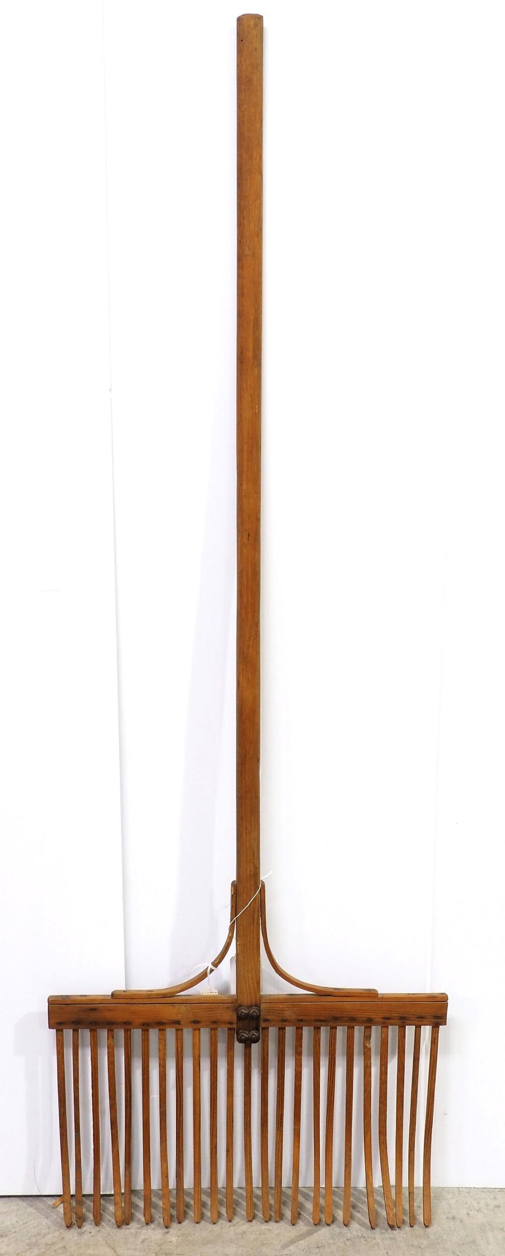 Lot 765: Early wooden 23-tine garden rake