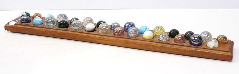 Lot 1335: Wooden display with 29 large marbles