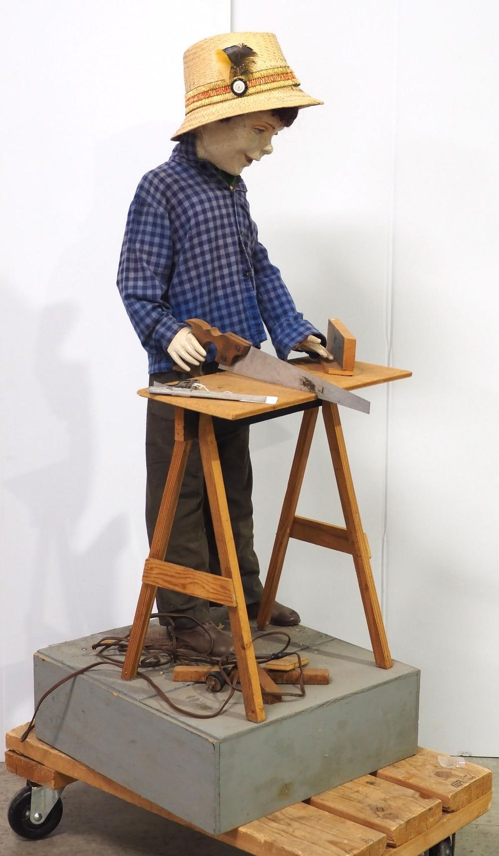 Lot 296: Animated display of boy sawing wood