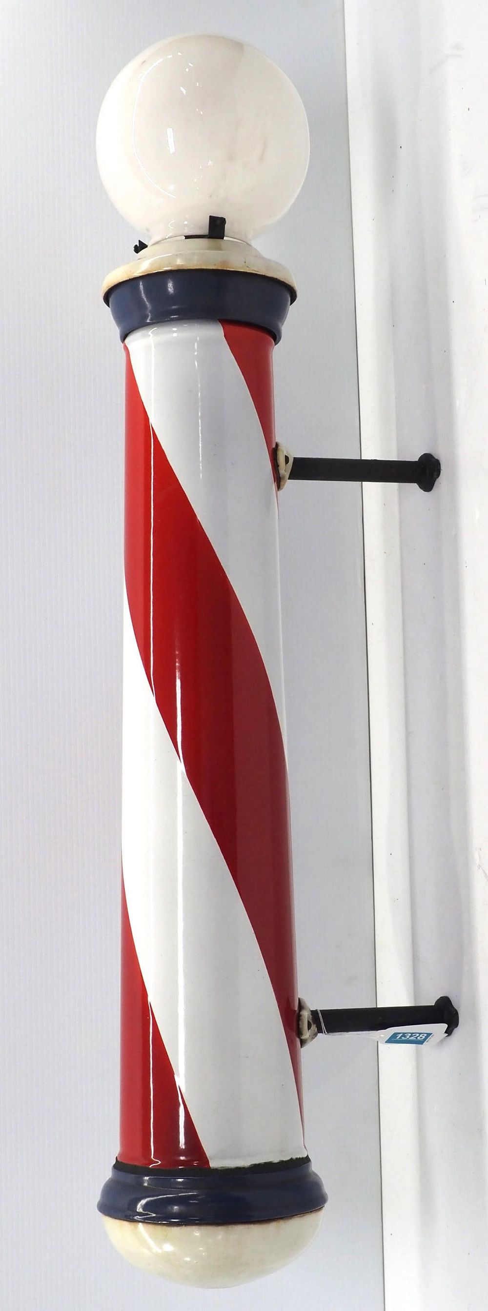 Lot 1328: Porcelain barber shop pole with lighted globe top