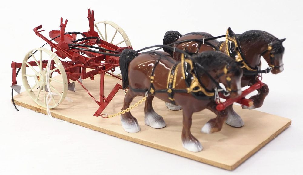 Lot 303: Custom cultivator hitched to a team of horses