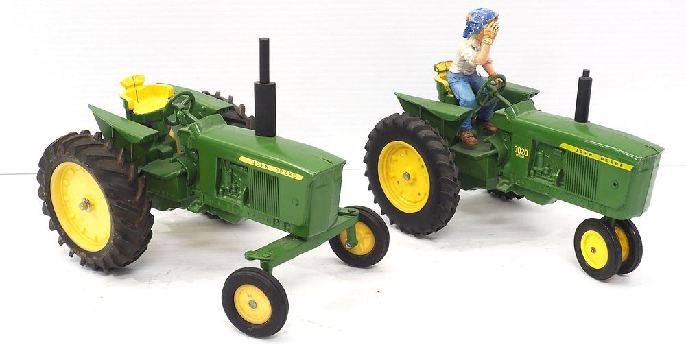 Lot 129: (2) Ertl John Deere Tractors