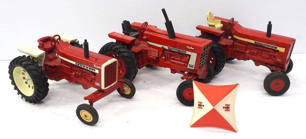 Lot 176: (3) Ertl Tractors