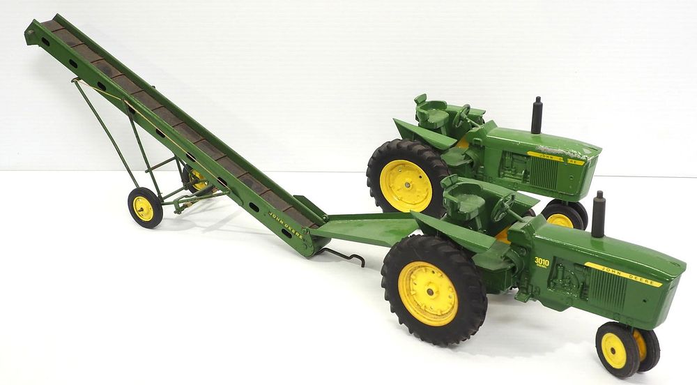 Lot 186: (2) Ertl John Deere Tractors & Elevator