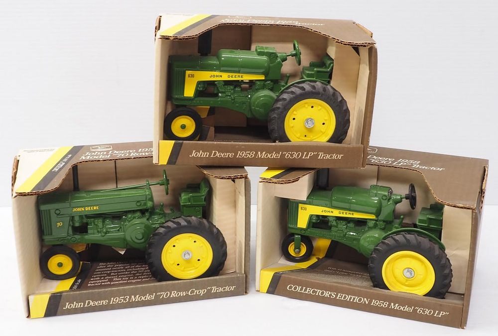 Lot 211: (3) Ertl John Deere Tractors