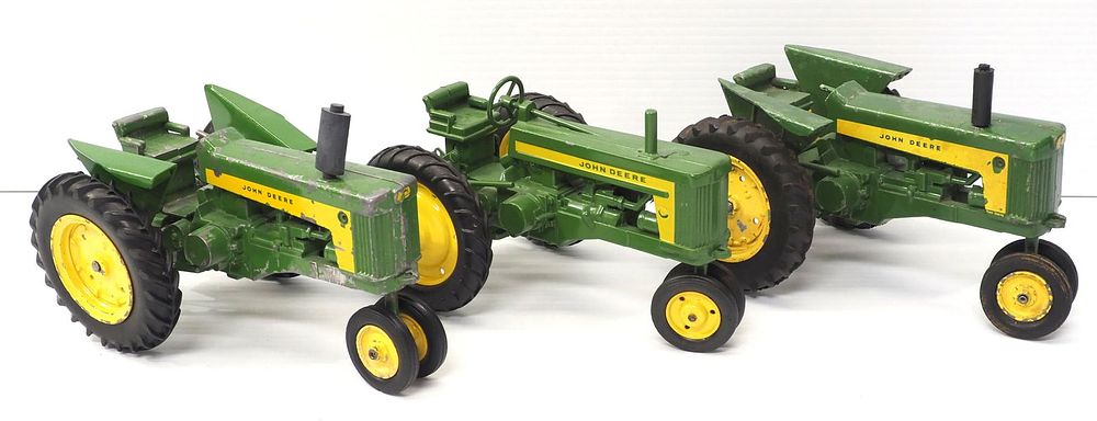 Lot 253: (3) Ertl John Deere Tractors