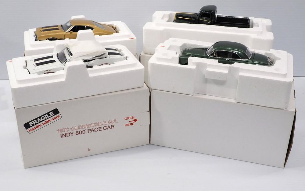 Lot 391: (4) Danbury Mint Replica Cars
