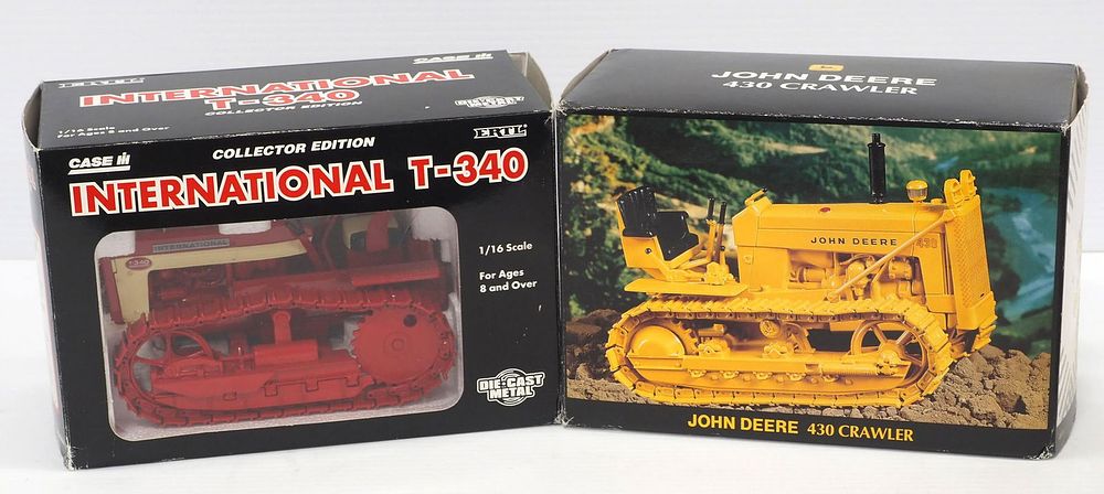 Lot 179: (2) Ertl Toy crawlers in boxes