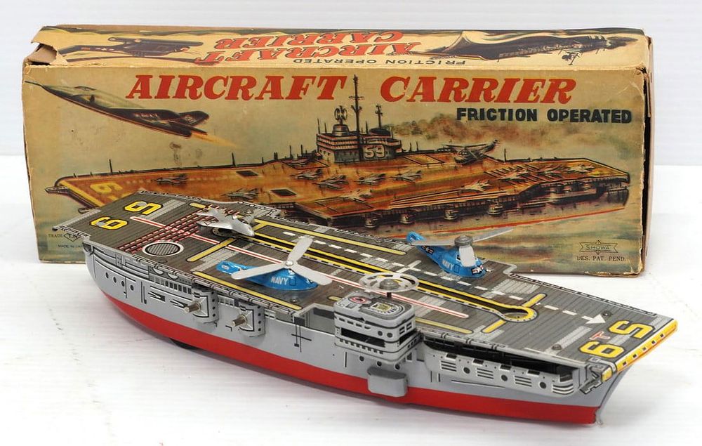 Lot 253: Tin aircraft carrier