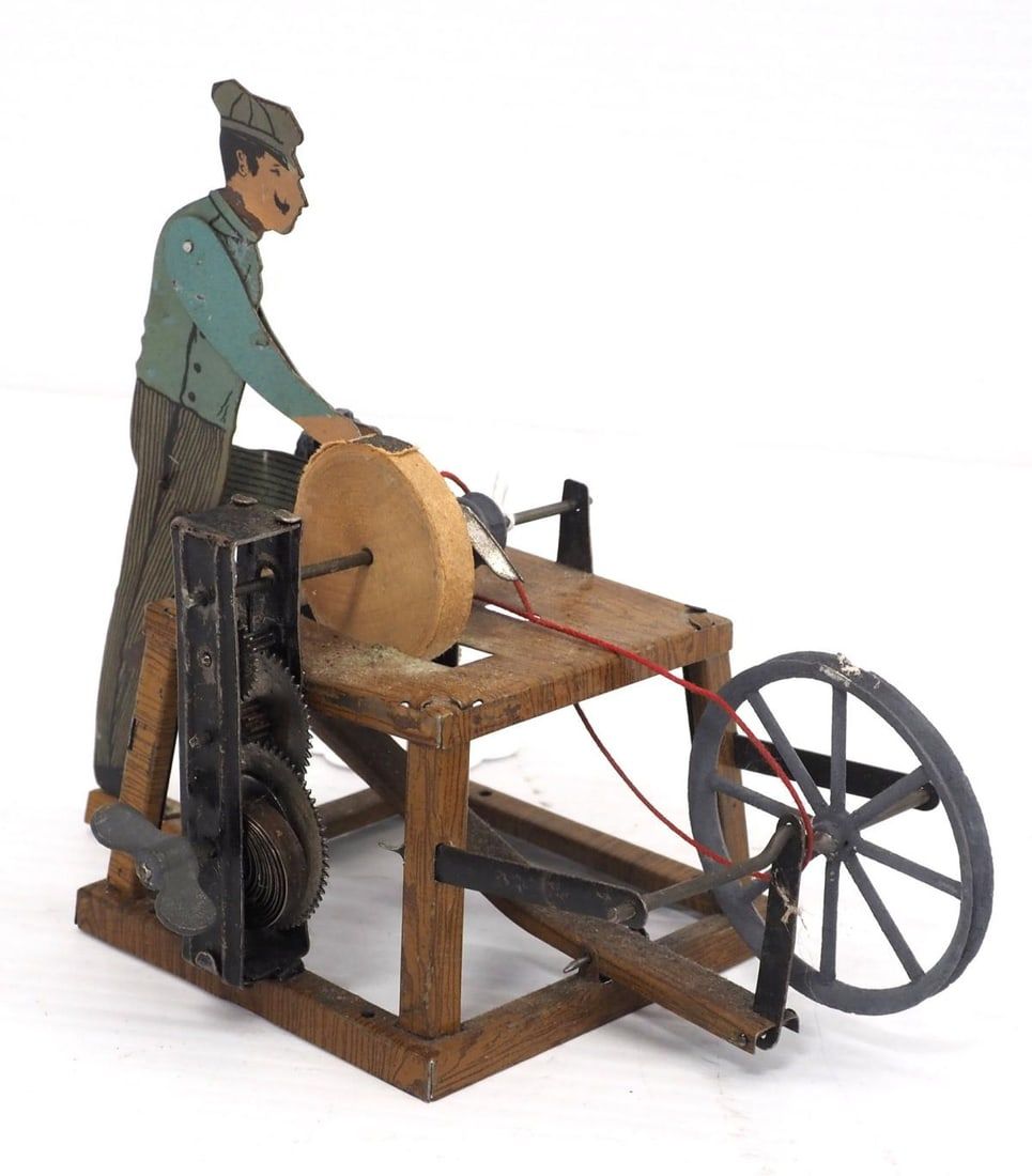 Lot 308: Fleischman wind-up scissor sharpener toy
