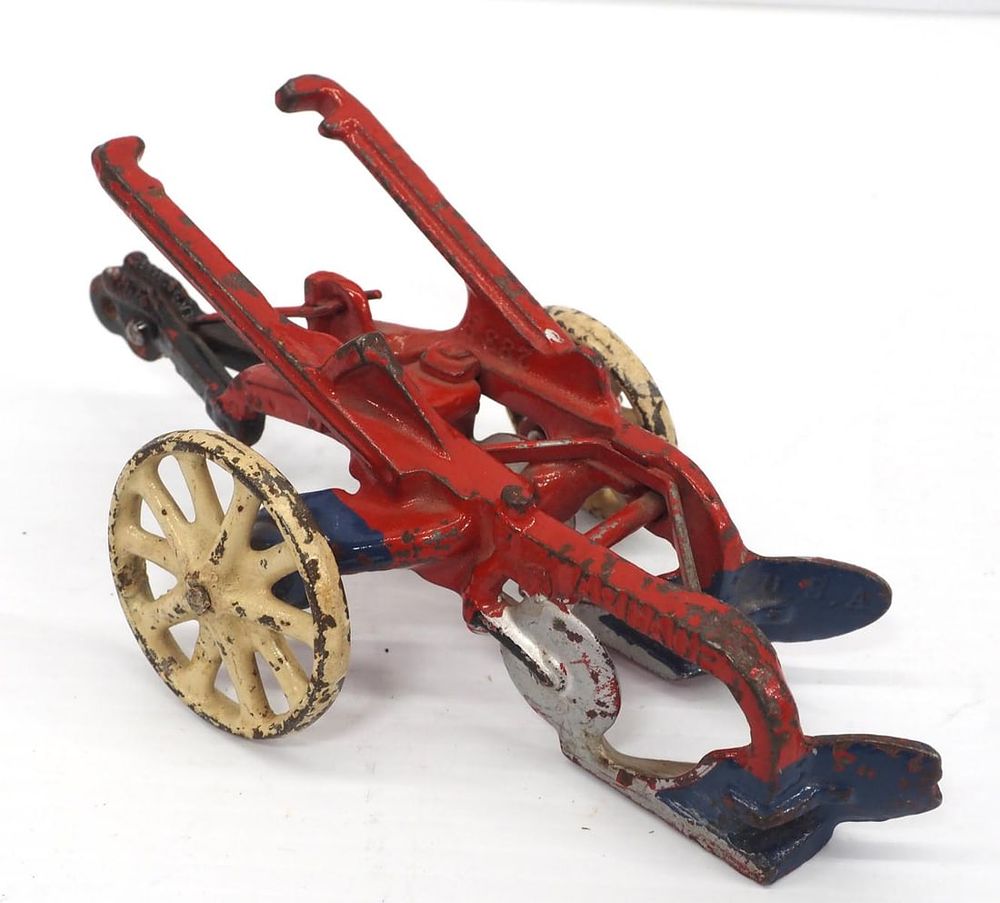 Lot 323: Arcade cast iron McCormick Deering 2-bottom plow