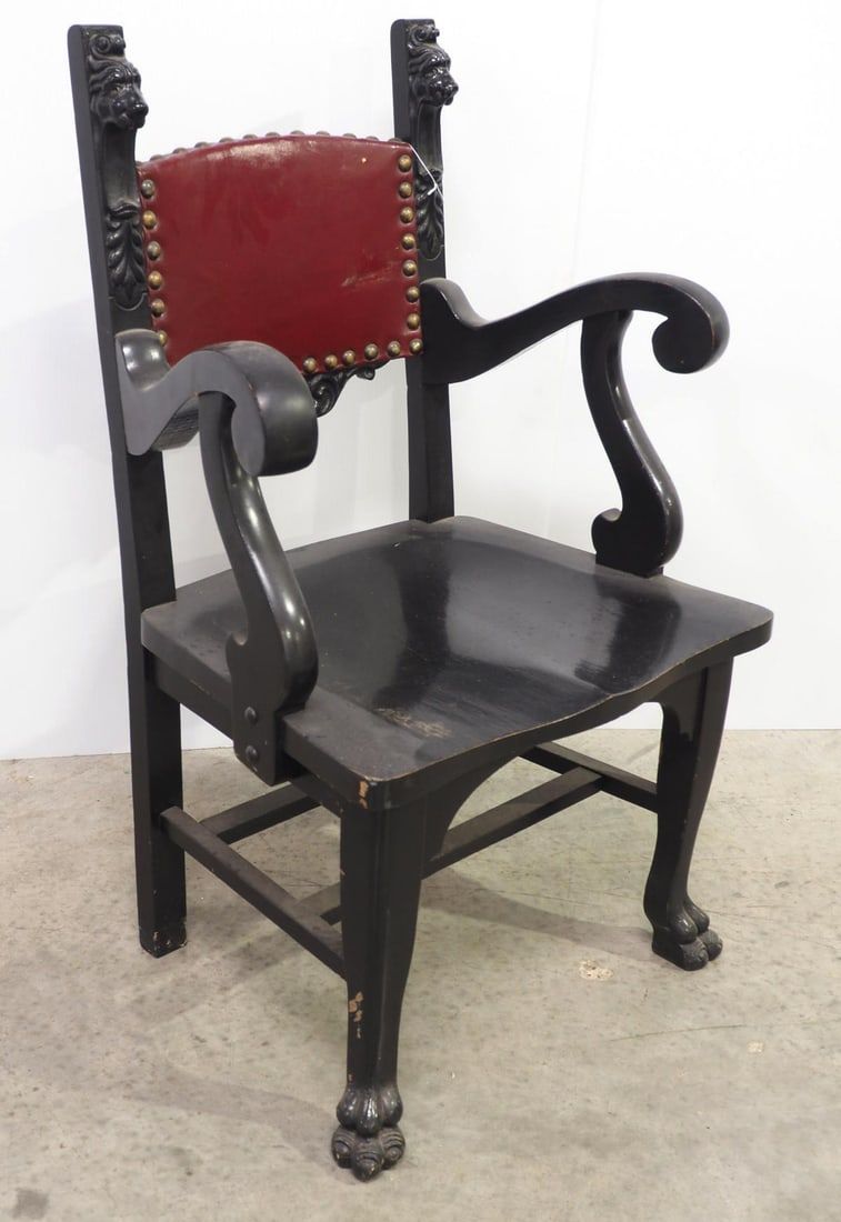 Lot 335: Wooden arm chair with carved lion heads