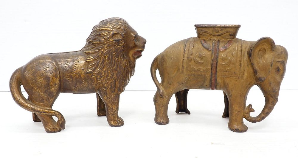 Lot 75A: Cast iron lion and elephant banks