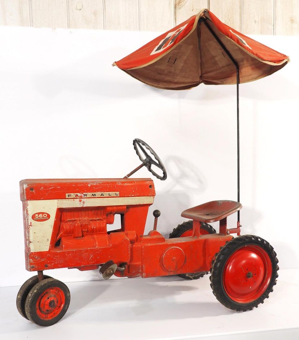 Lot 1188: Early Farmall 560 pedal tractor