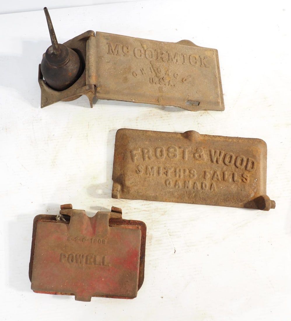 Lot 1331: (3) Embossed cast iron lids
