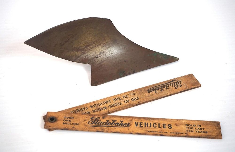 Lot 80: SS plow share / wooden ruler