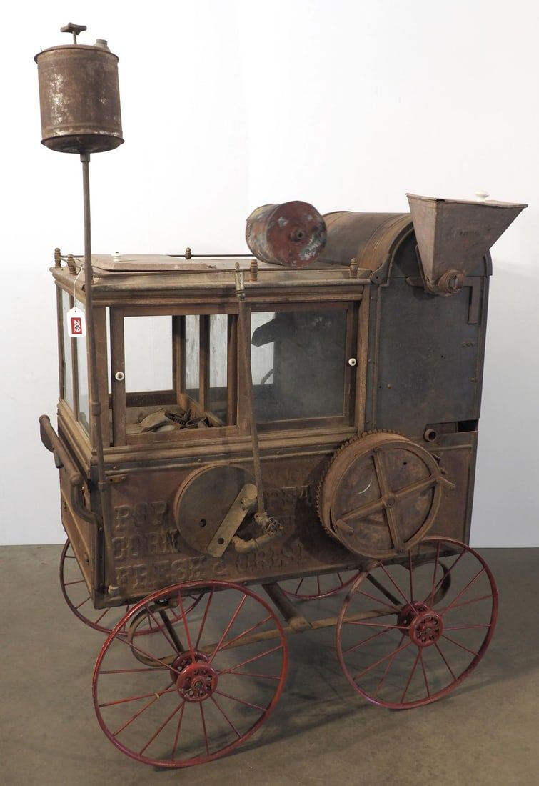 Lot 209: Cast iron & tin peanut vendor wagon