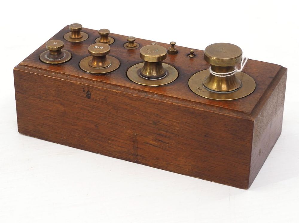 Lot 250: 11-pc. brass Newark scale weights