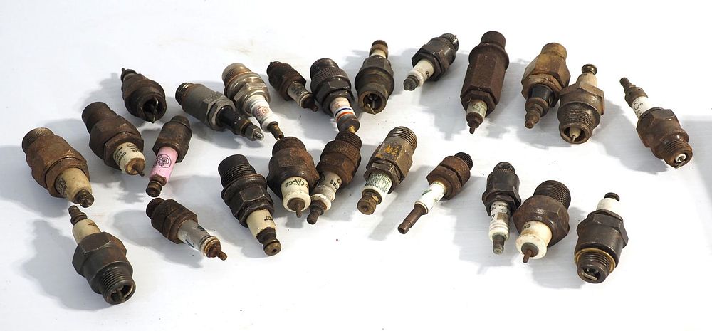 Lot 251: (24) Various porcelain spark plugs