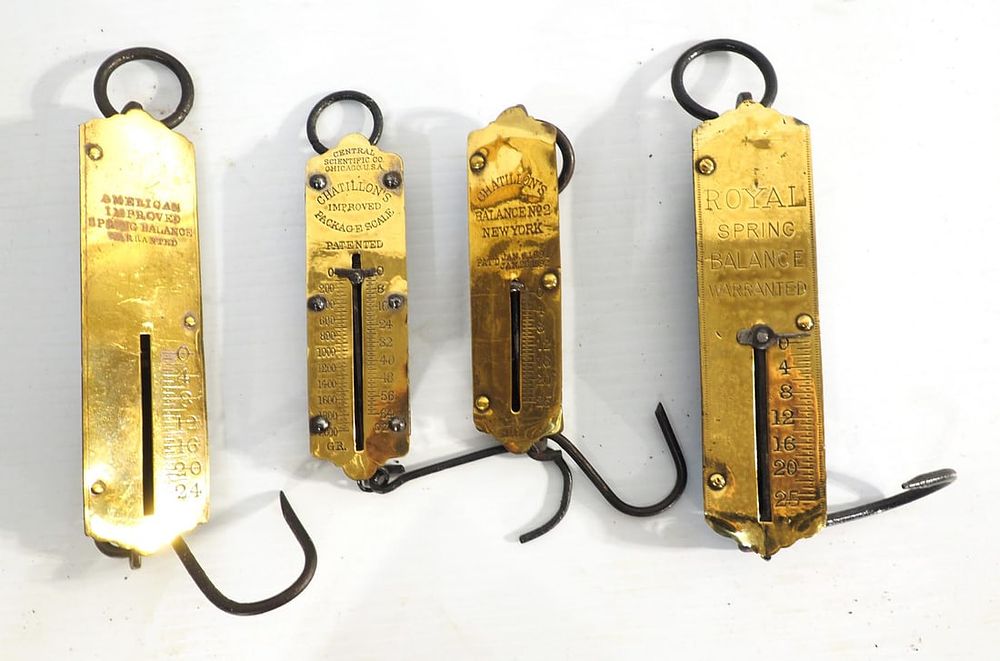 Lot 449: (4) Small brass face scales