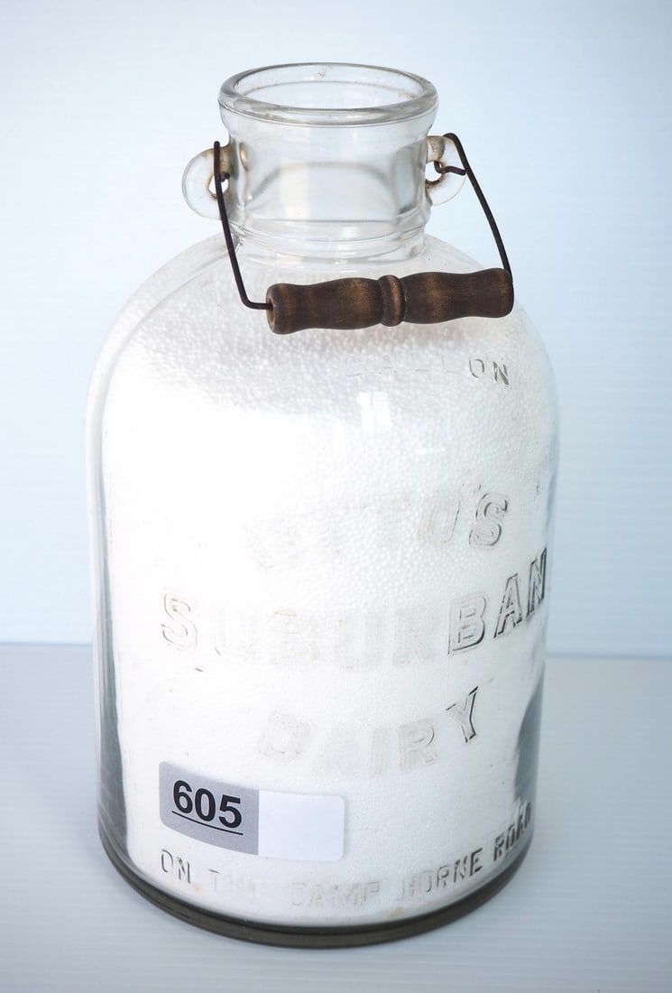 Lot 605: 1 gallon milk bottle