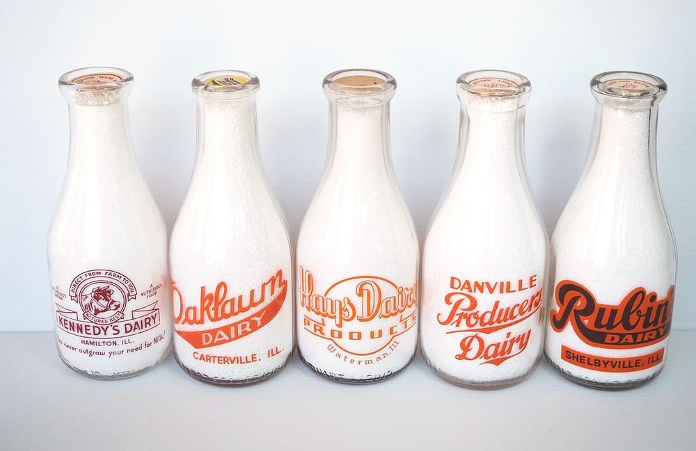 Lot 634: (5) 1 quart milk bottles