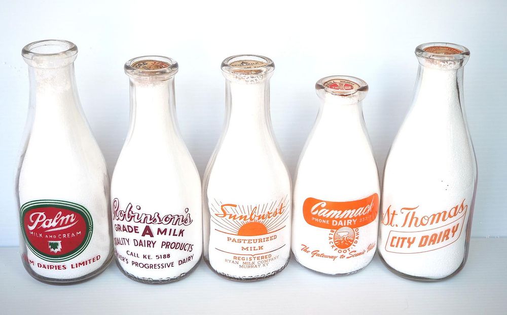 Lot 644: (5) 1 quart milk bottles