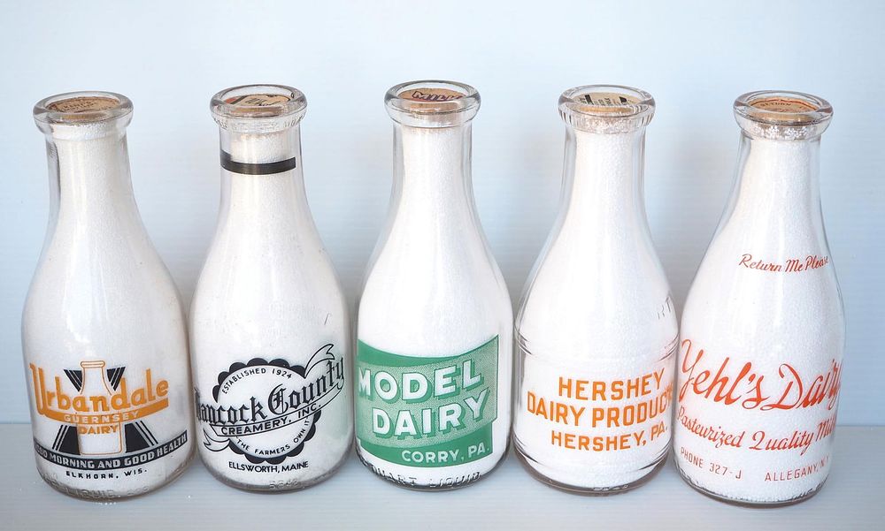 Lot 647: (5) 1 quart milk bottles