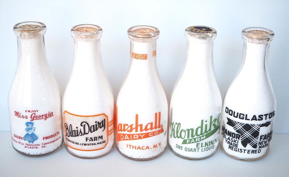 Lot 648: (5) 1 quart milk bottles