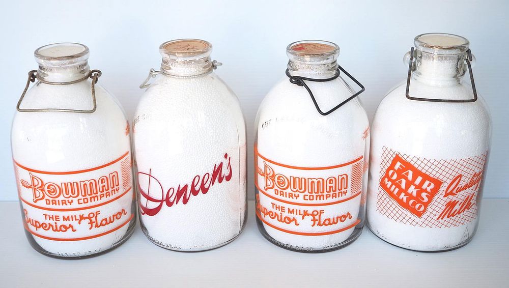 Lot 686: (4) 1 gallon milk bottles