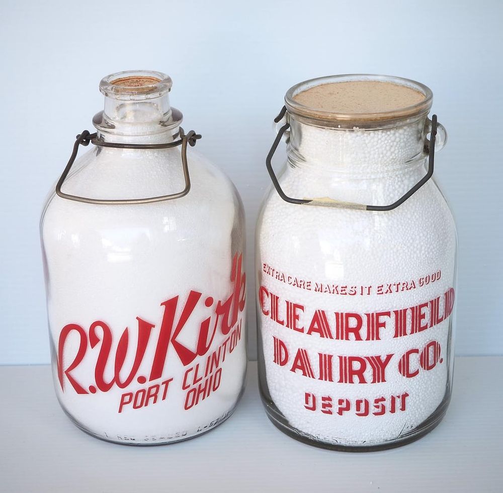 Lot 692: (2) 1 gallon milk bottles