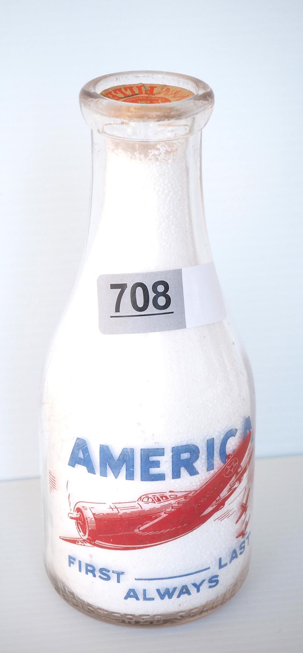 Lot 708: 1 quart milk bottle