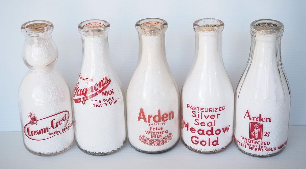 Lot 716: (5) 1 quart milk bottles