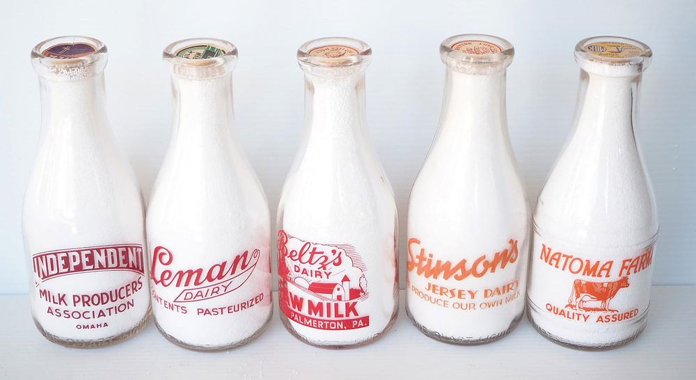 Lot 748: (5) 1 quart milk bottles
