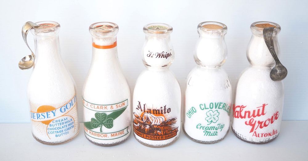 Lot 749: (5) 1 quart milk bottles