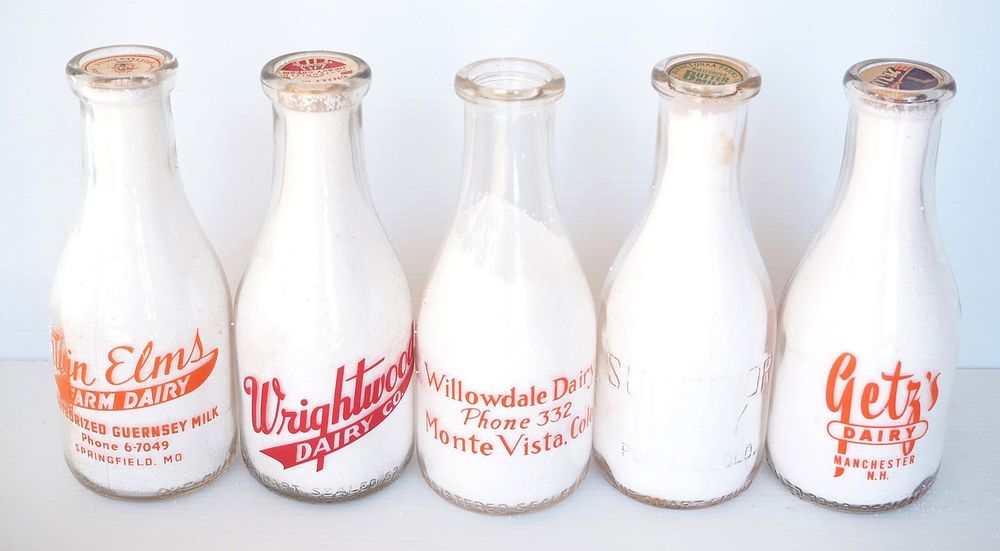 Lot 775: (5) 1 quart milk bottles