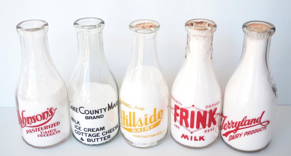 Lot 776: (5) 1 quart milk bottles