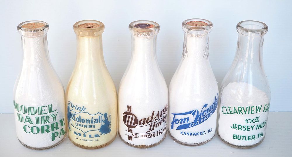 Lot 777: (5) 1 quart milk bottles