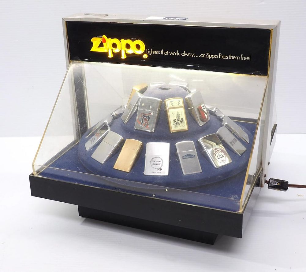 Lot 2243: Zippo display case and 24 Zippo lighters