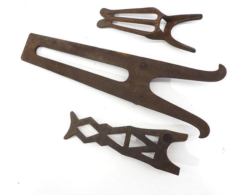 Lot 1035: (3) Cast iron boot jacks