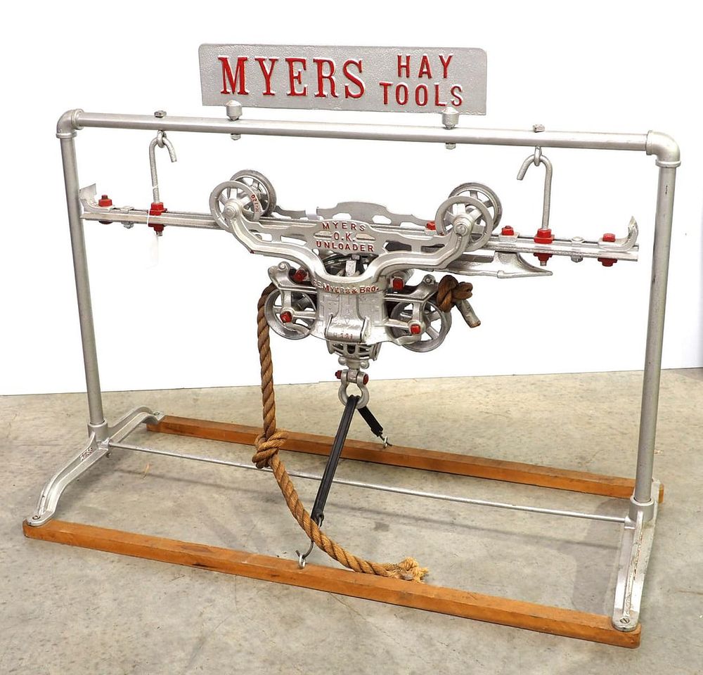 Lot 1545: Myers Hay Tools display stand with hay car
